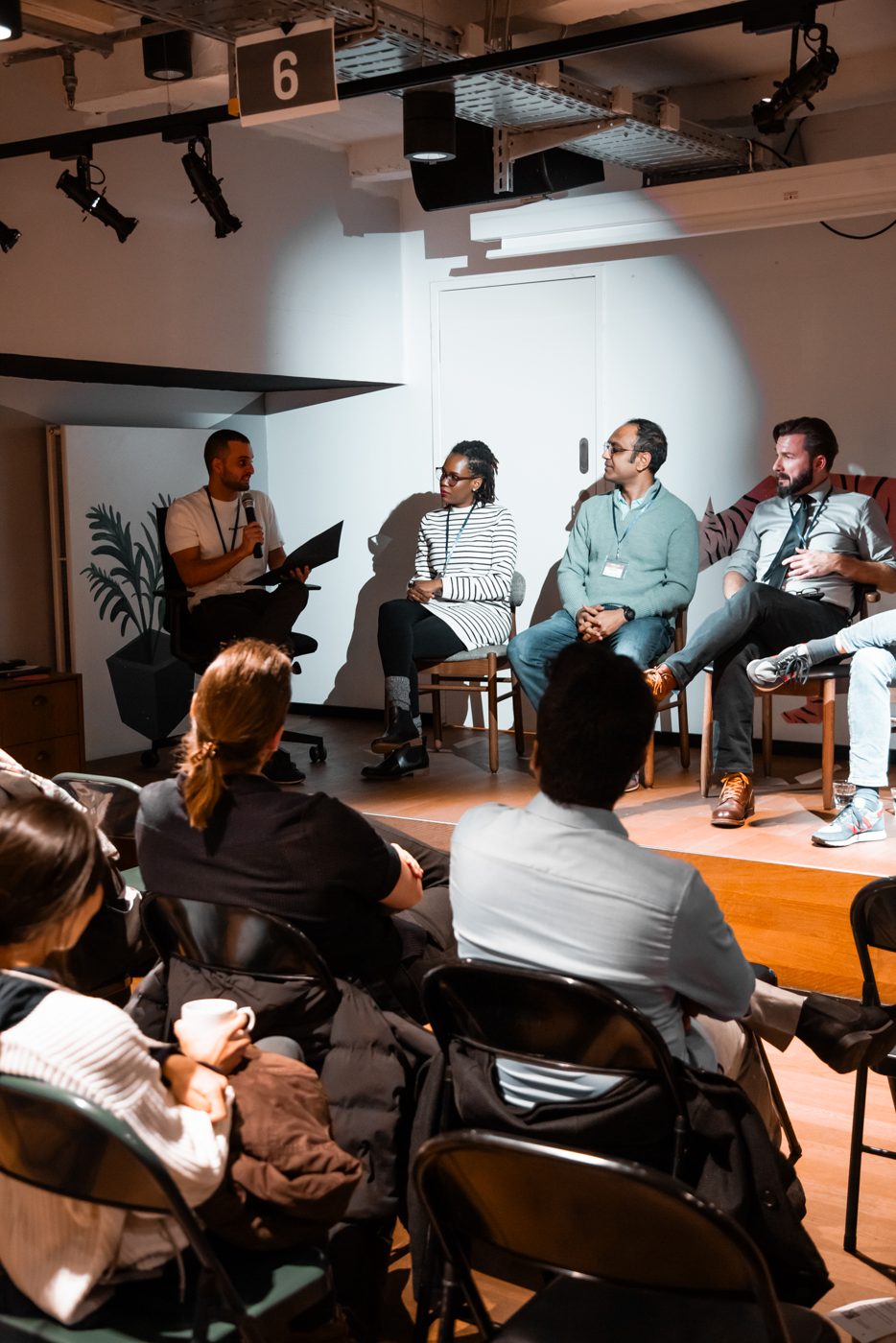 A speaker answering a question on stage