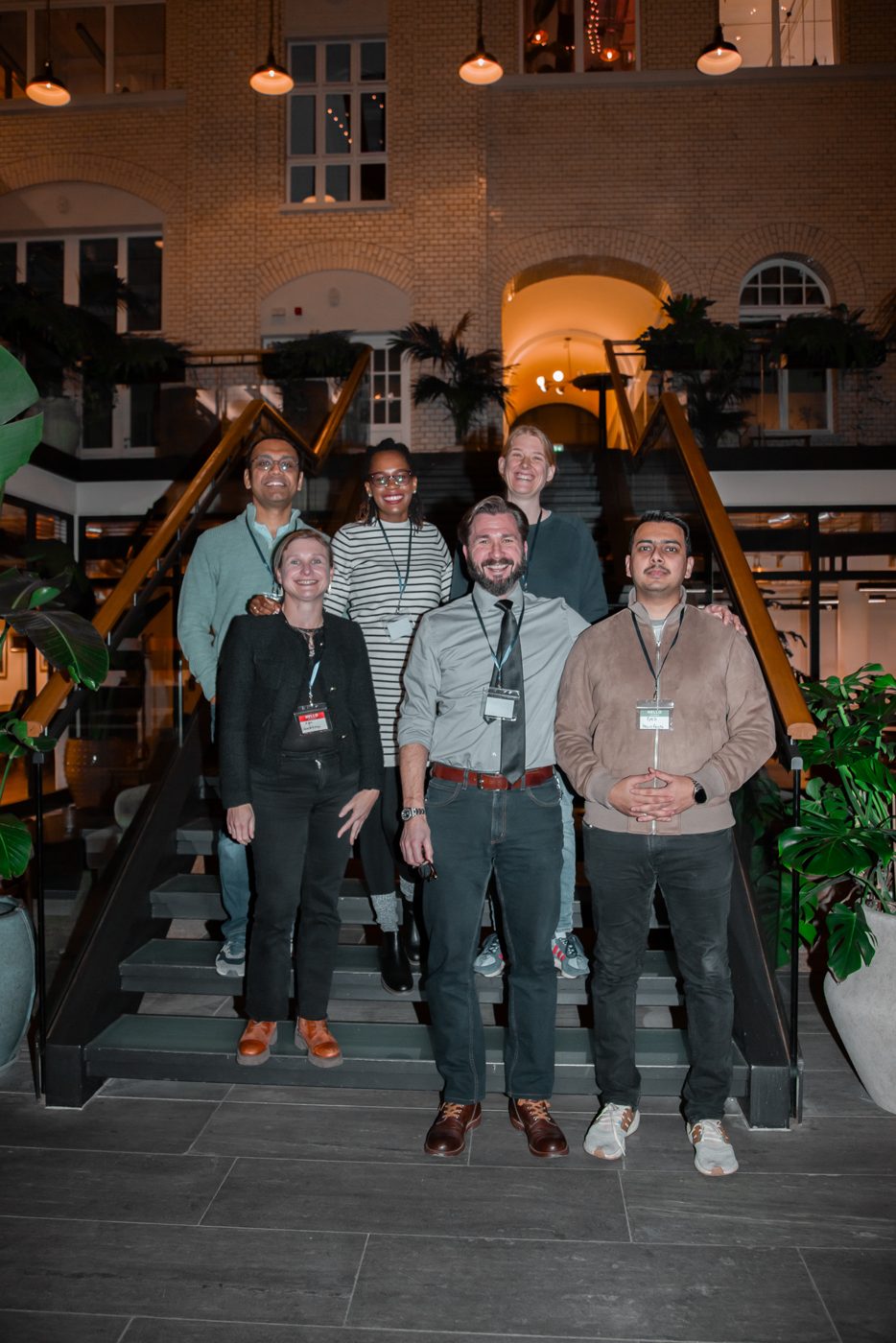 Speakers on the stairs after an event